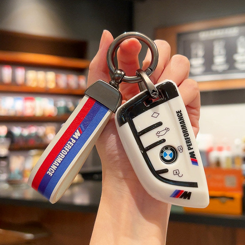 BMW M Performance white leather key case with woven M-stripe fabric strap