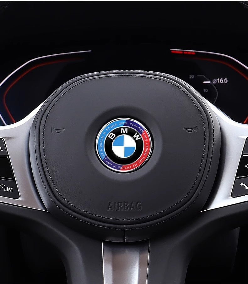 BMW co-branded steering wheel badge installed