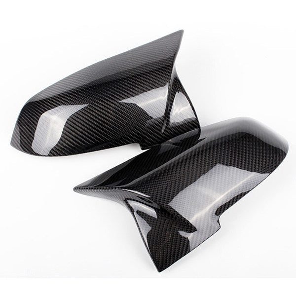 BMW carbon fiber horn mirror cover pair on white background