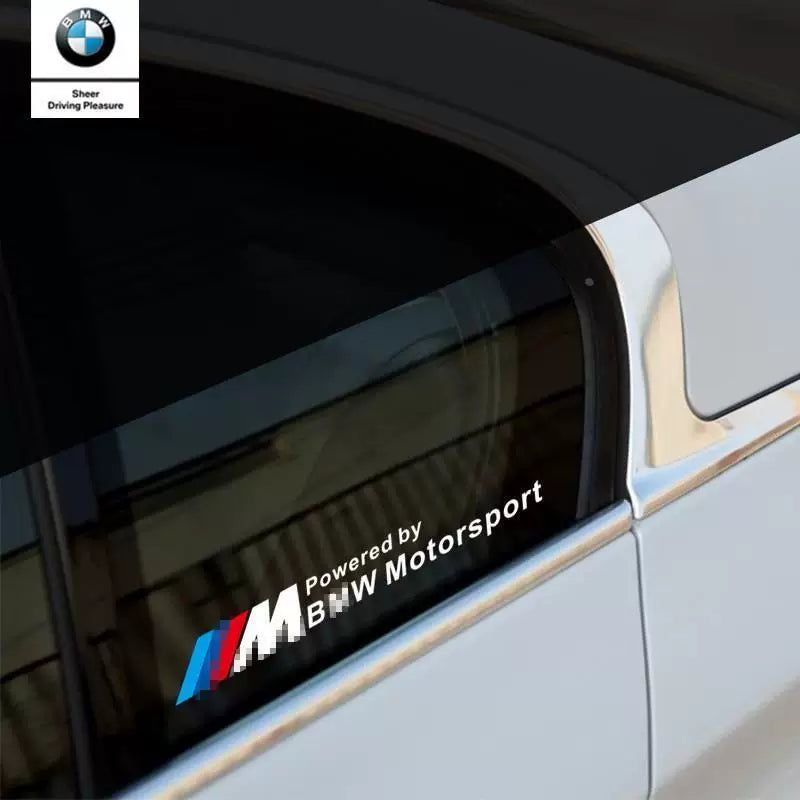 BMW M Powered by BMW Motorsport window triangle sticker on white BMW rear door glass