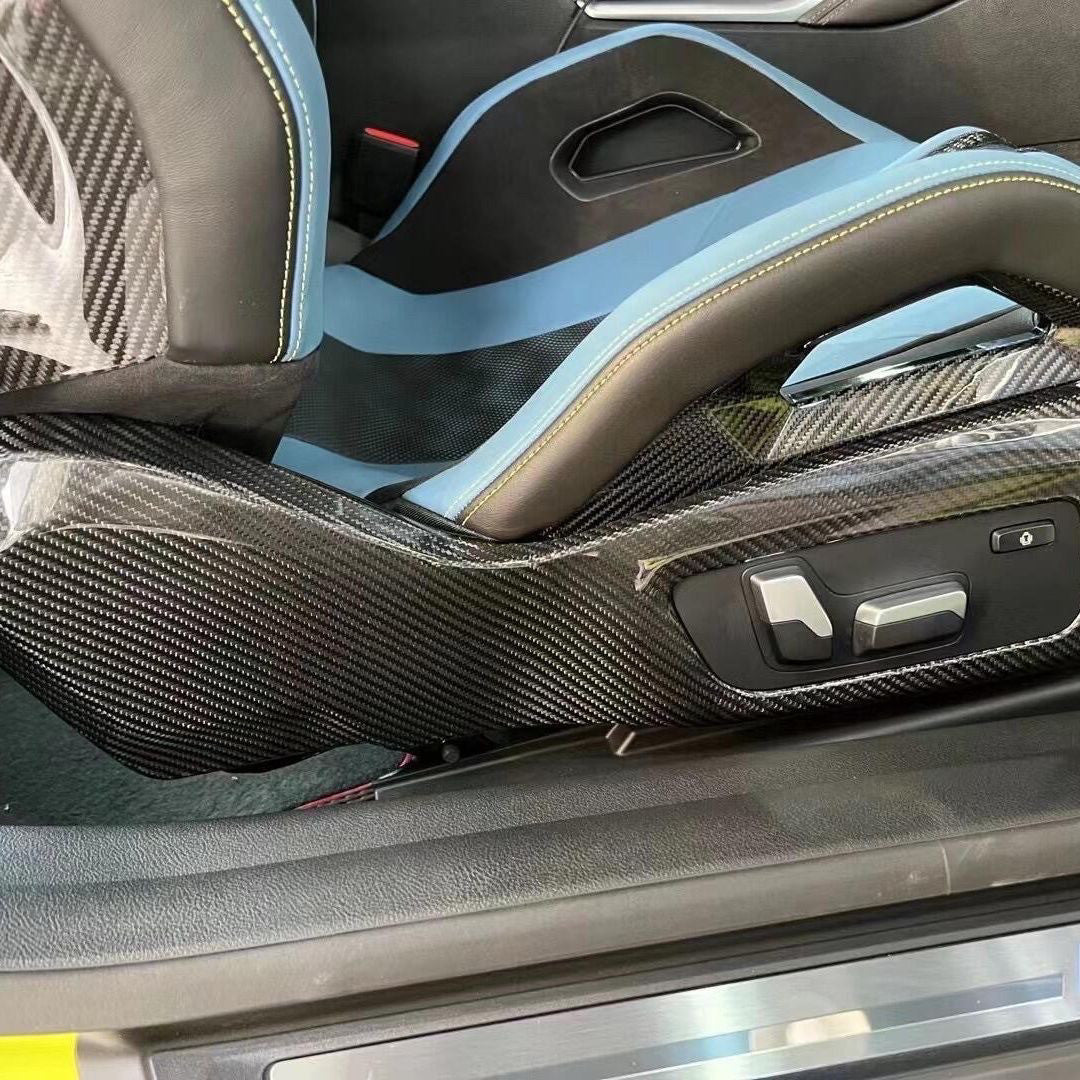 BMW G80 carbon fiber seat side trim panel installed close-up