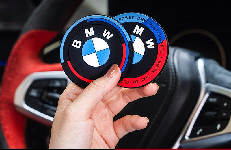 BMW logo silicone coasters held in hand, blue and red finish