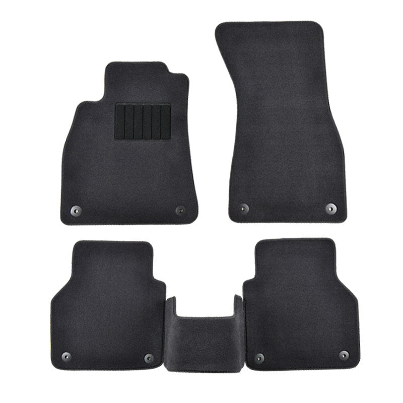 BMW 5-piece floor mat set laid out, black velvet carpet