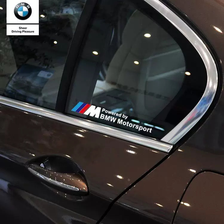 BMW M Powered window sticker applied to rear side window on brown BMW sedan