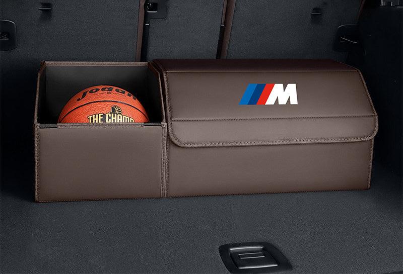 BMW M Performance trunk storage box with extended open basket holding a basketball