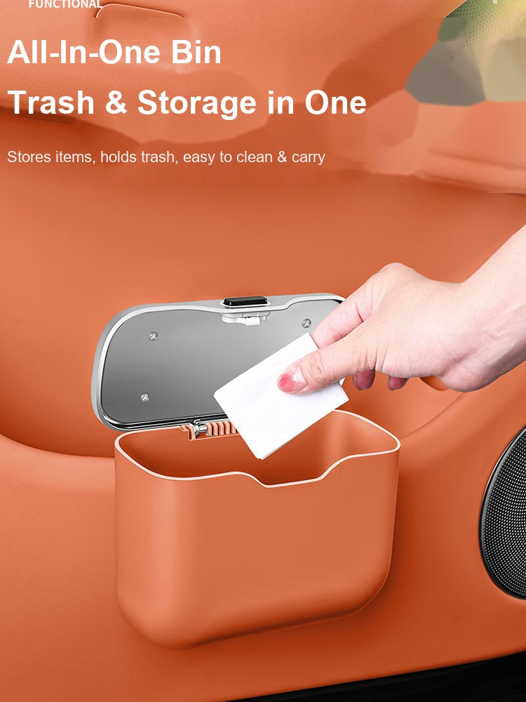BMW trash bin used for storage and garbage, orange color, hand placing tissue