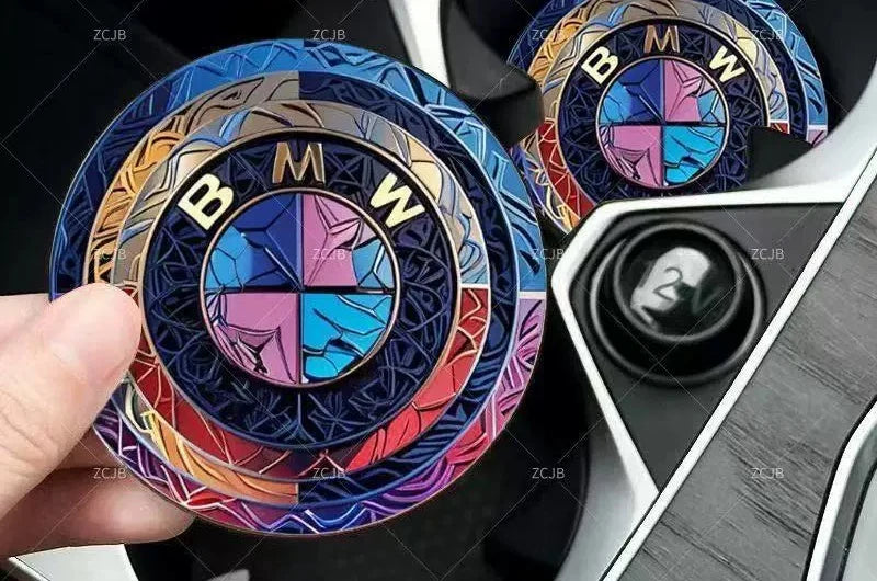 BMW logo car coasters, colorful holographic design, held in hand near cup holder