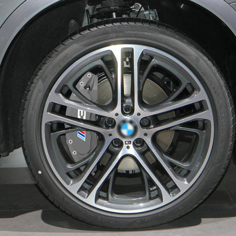 BMW wheel fitted with M-style brake caliper cover, close-up view