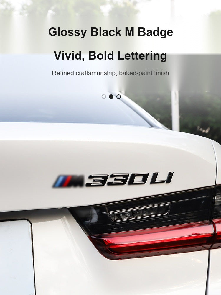 Glossy black BMW M badge with vivid lettering