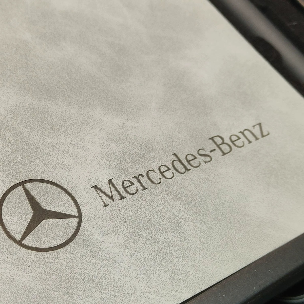 Close-up of the embossed Mercedes-Benz star and lettering