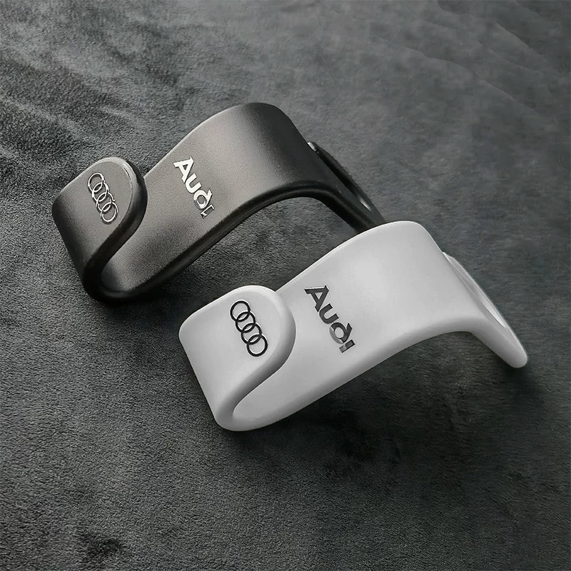 Audi seat back hooks in black and white with four rings emblem