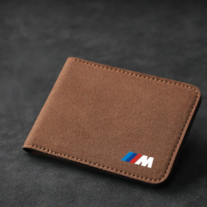 Close-up of BMW M Performance suede leather texture on brown driver's license holder