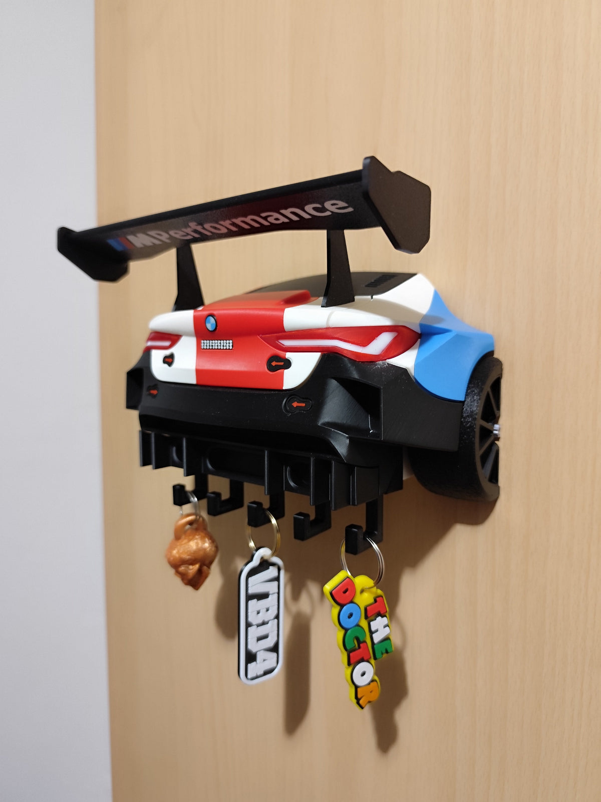 BMW M4 GT3 wall key holder side angle view with keys