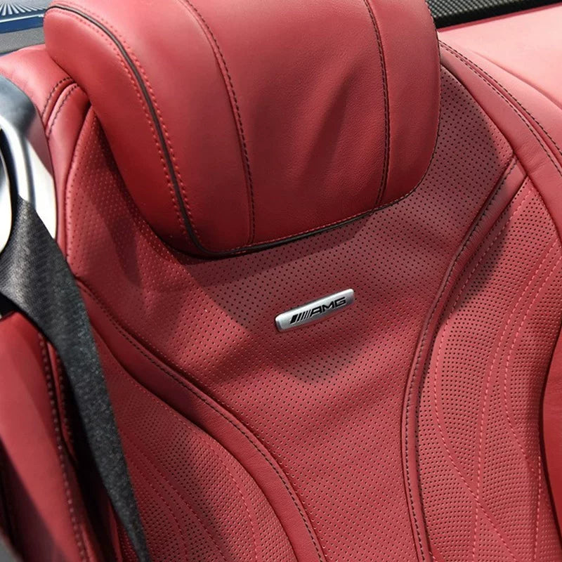 AMG seat emblem fitted on a red leather Mercedes-Benz seat backrest