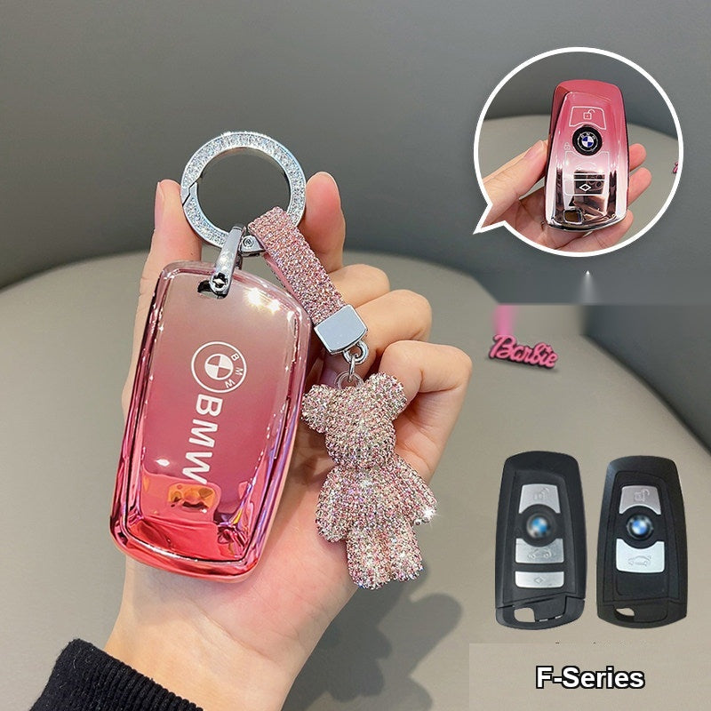 BMW clear glossy cherry blossom pink TPU key case with diamond-encrusted bear keychain