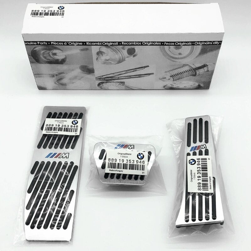 BMW aluminum alloy pedal cover set in original packaging with BMW parts box