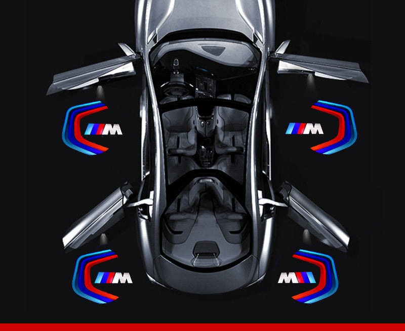 M racetrack welcome light projected from all four car doors