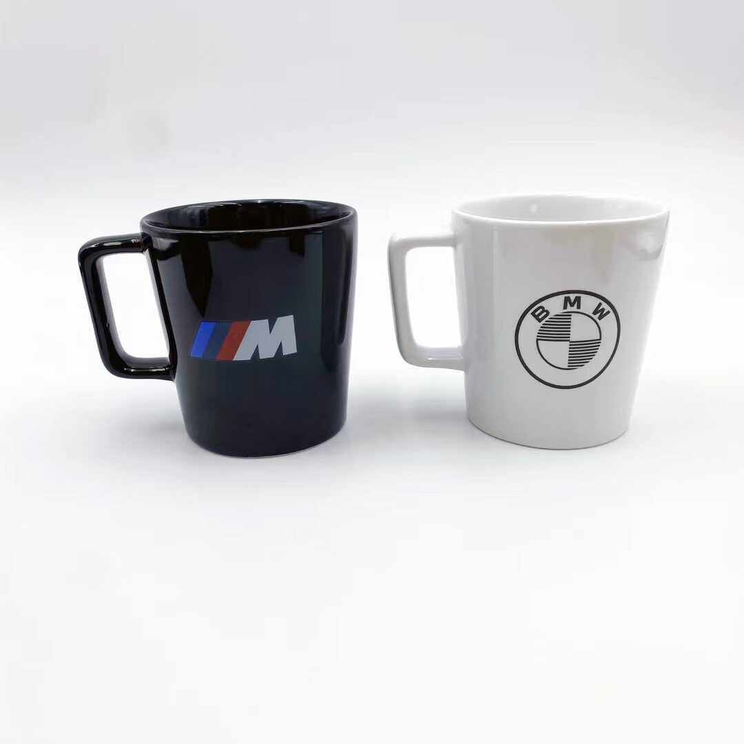 BMW ceramic mugs, black and white, side by side comparison