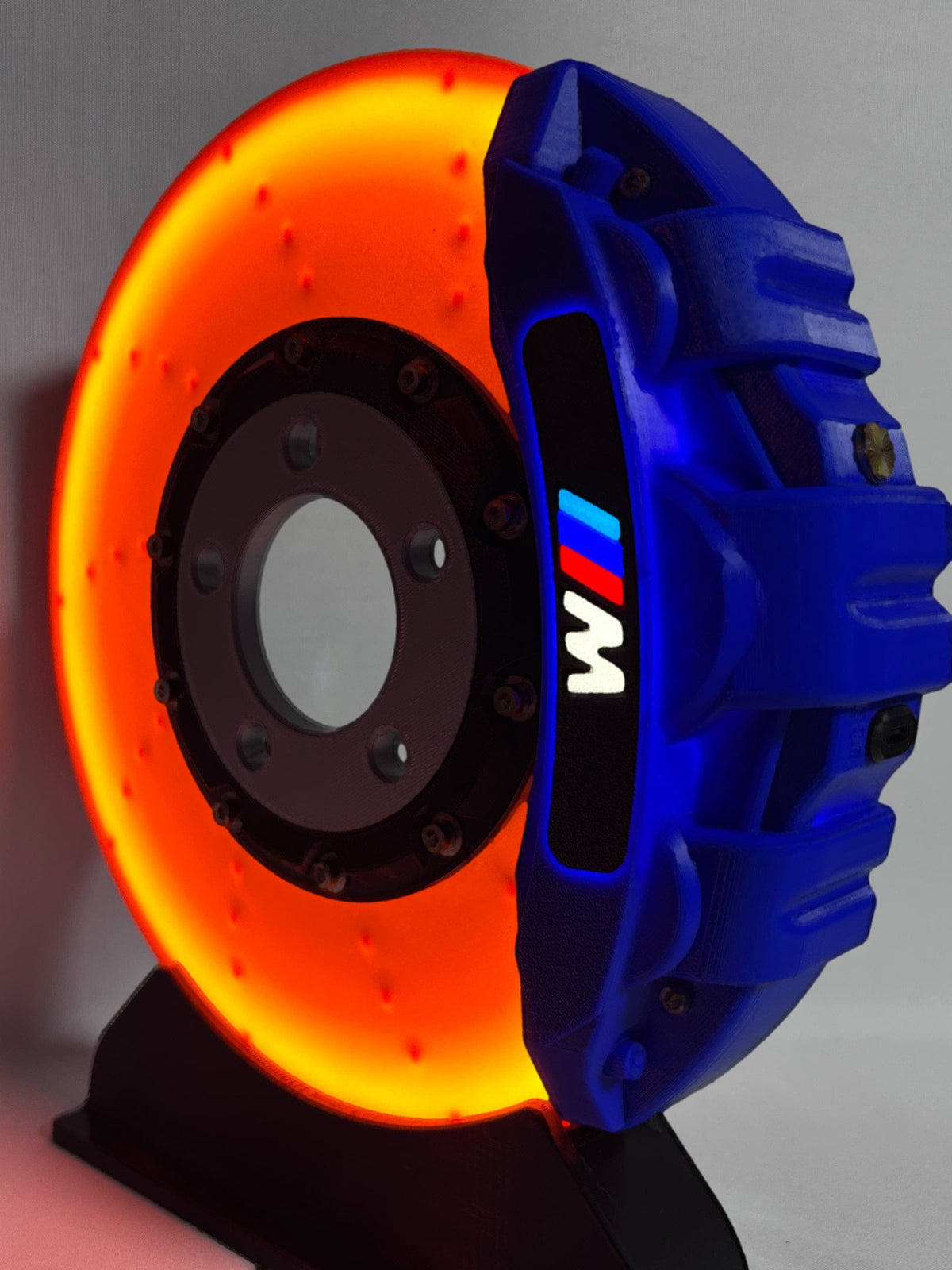 BMW M brake disc LED night light, blue caliper, front view