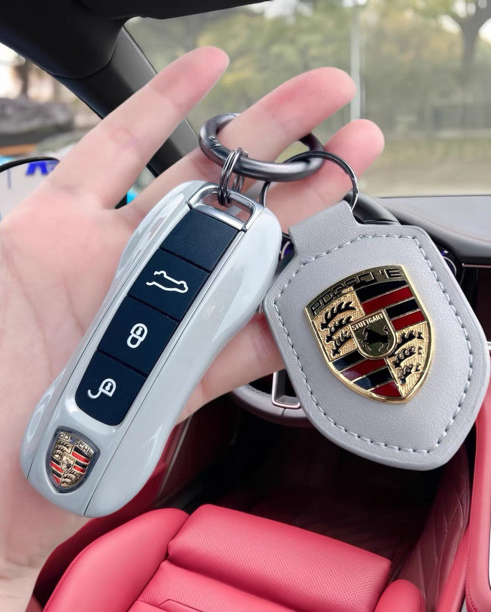 Porsche Key Case Set – Glossy Shell with Wrist Strap and Crest Keychain for Macan, Cayenne, Panamera, 911, Taycan and 718