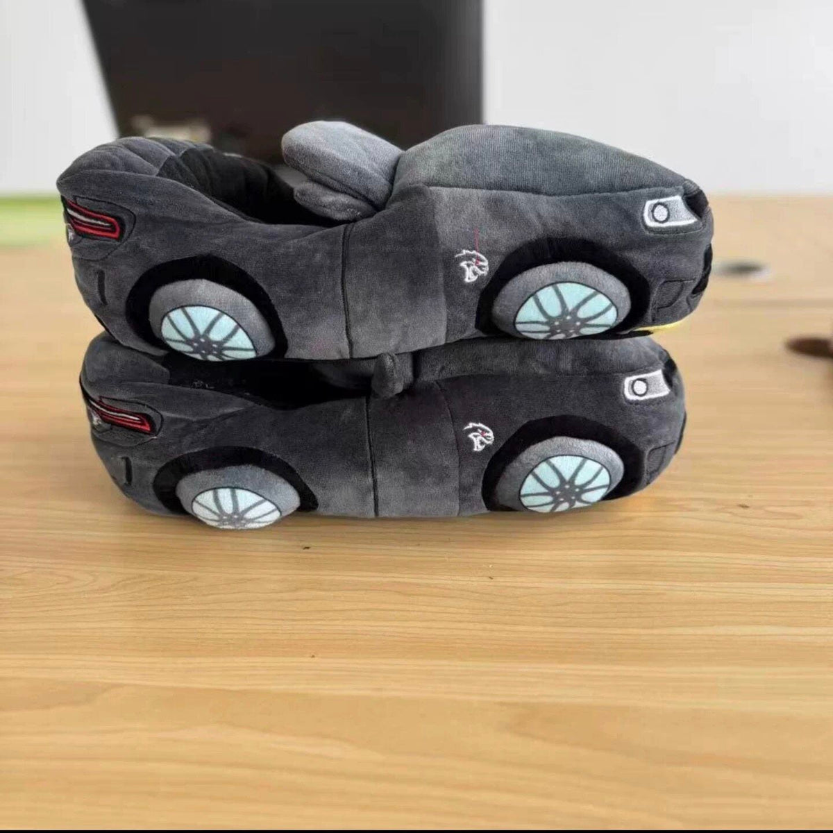 Dodge-style sports car plush slippers, gray, rear view