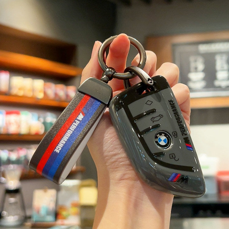 BMW M Performance grey leather key case with woven M-stripe fabric strap