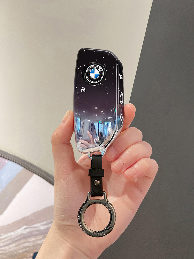 BMW new model smart key case held in hand, angled view