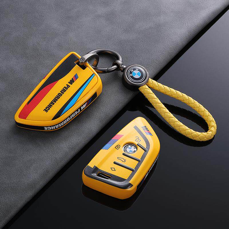 BMW Style B G-Series key fob case, yellow shell, braided logo cord keychain