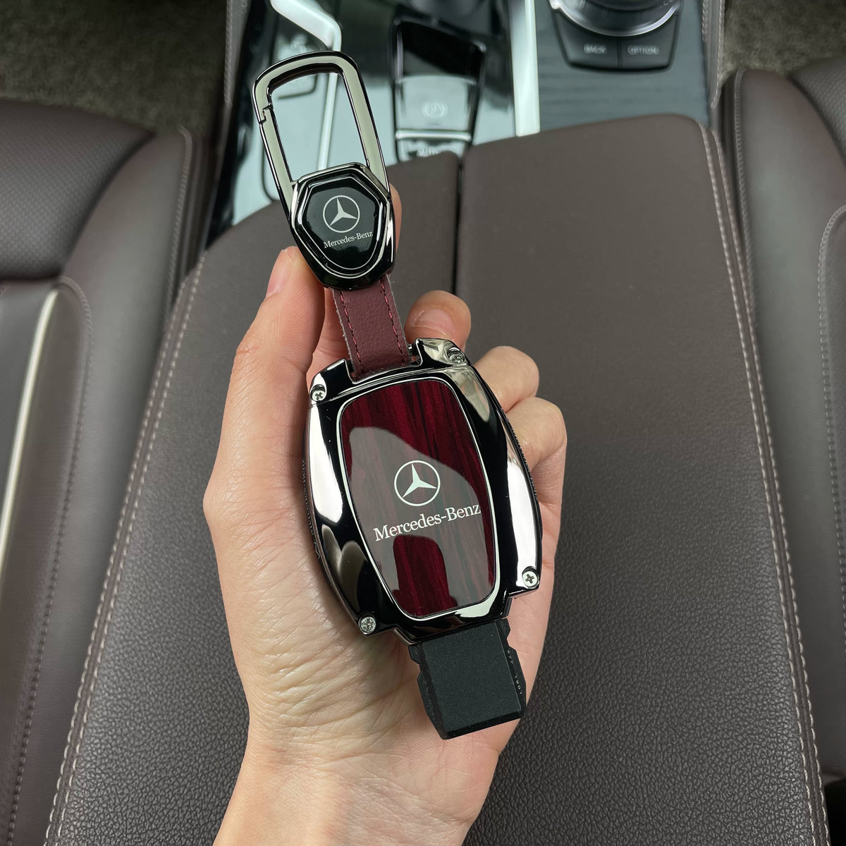 Mercedes-Benz woodgrain key case in redwood grain with carabiner keychain