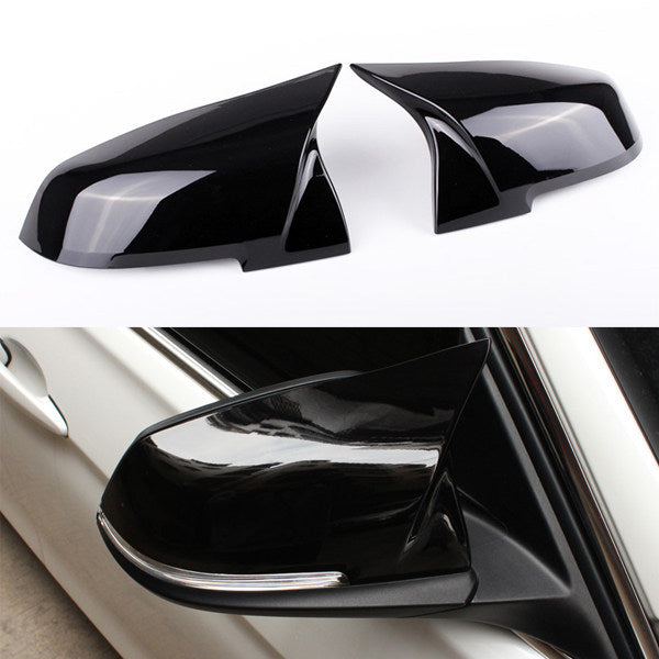BMW glossy black horn mirror cover close up