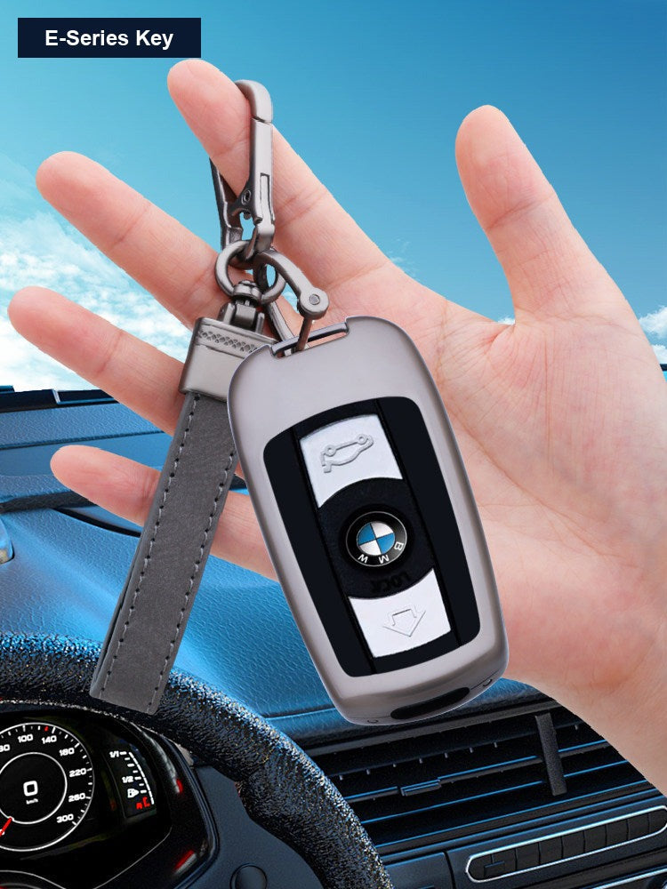 BMW E-Series smart key with protective case, held in hand