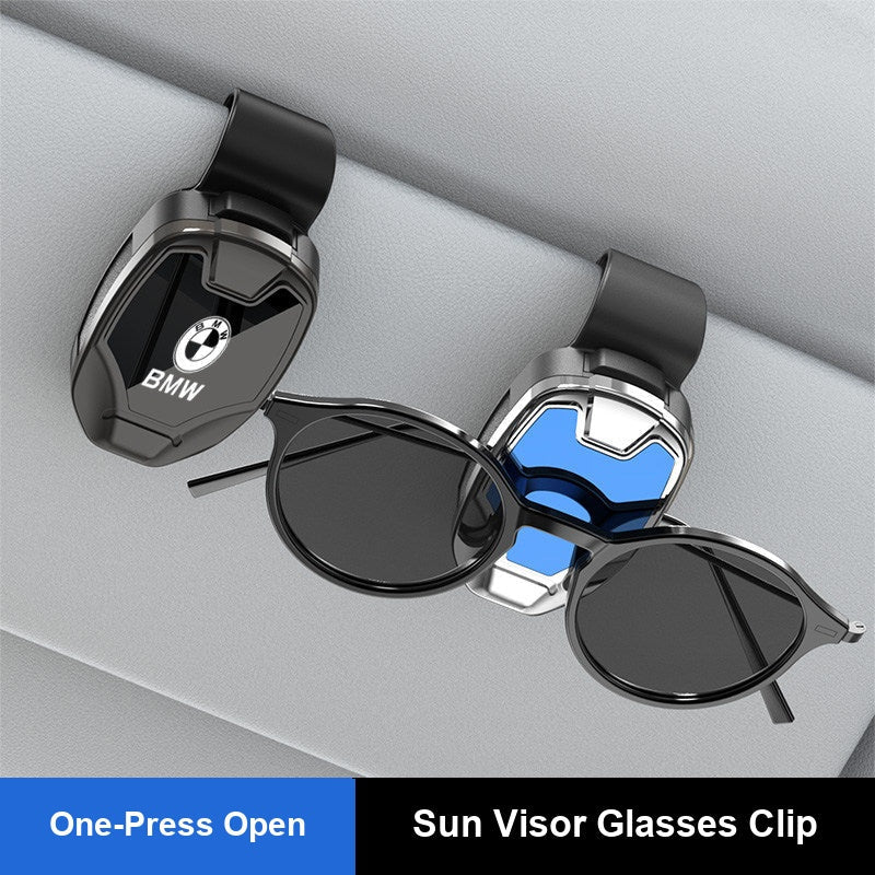BMW sun visor clip holding sunglasses mounted on car visor