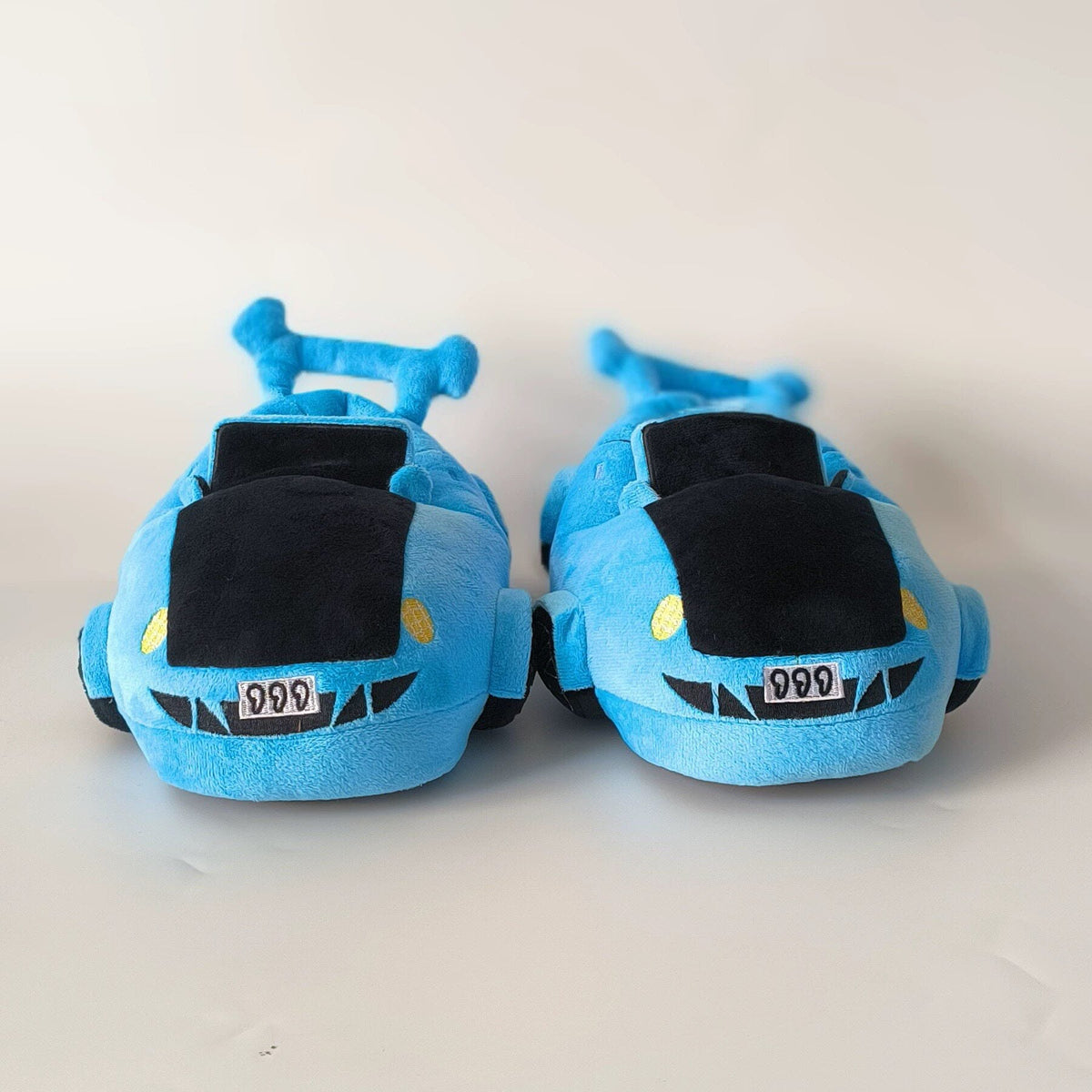 Lake blue sports car plush slippers, rear view with spoiler