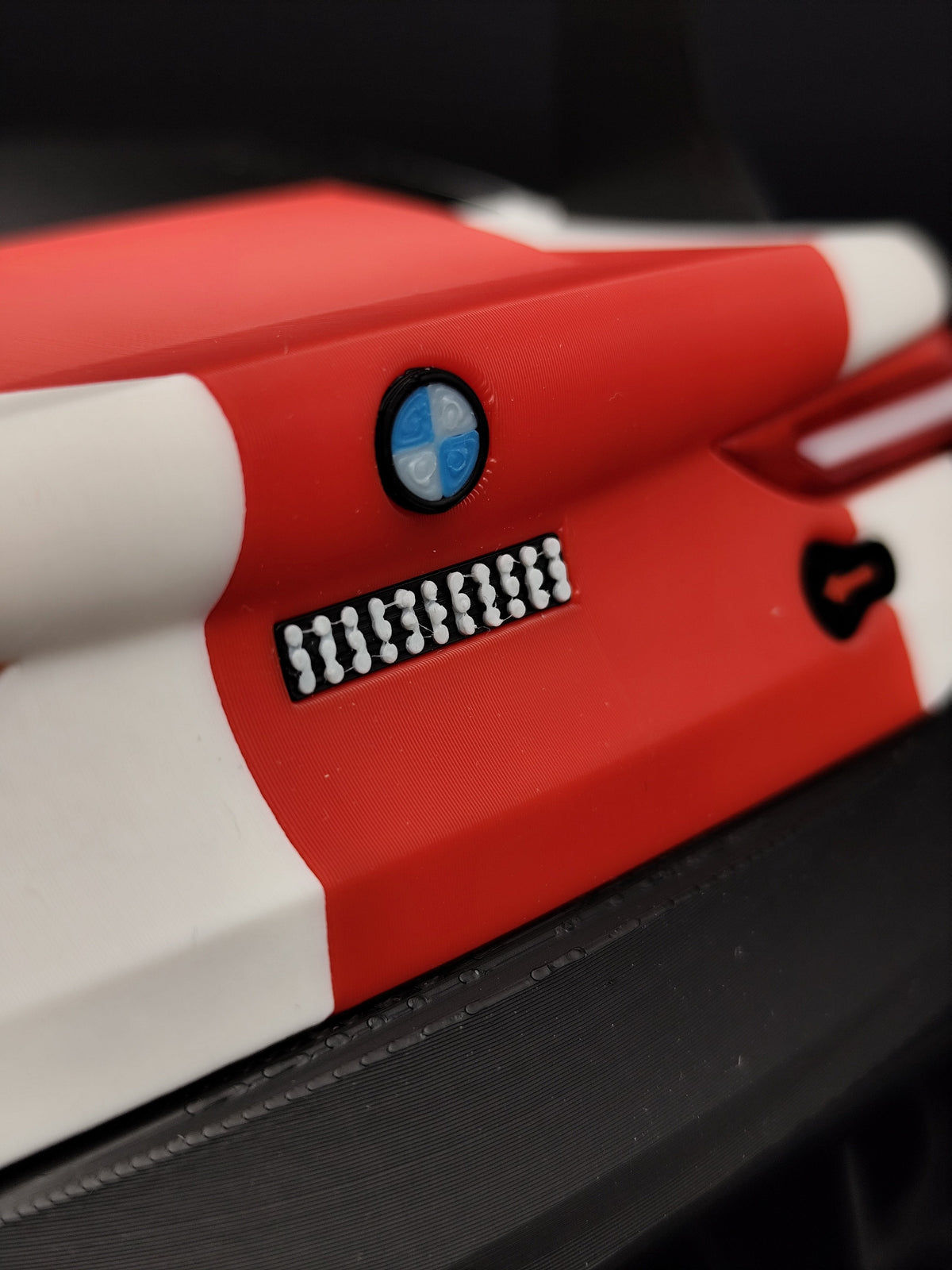BMW M4 GT3 wall key holder close-up of BMW roundel badge
