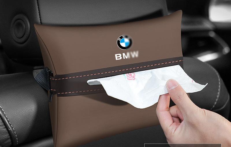 BMW leather seat back tissue holder mounted on headrest with tissue pulled out