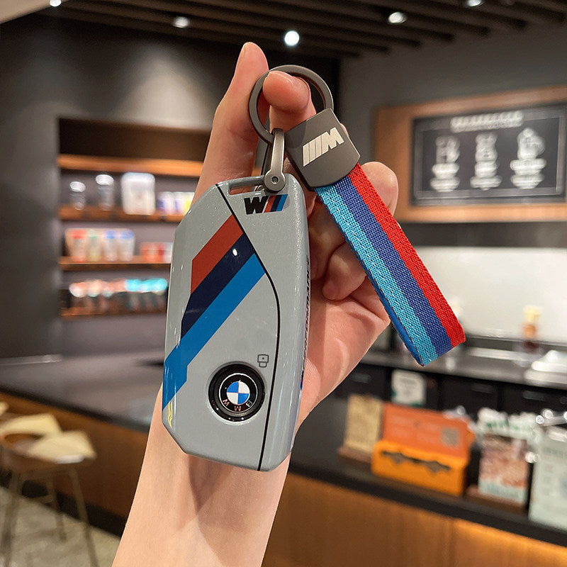 BMW M Performance grey leather key case with woven M-stripe fabric strap