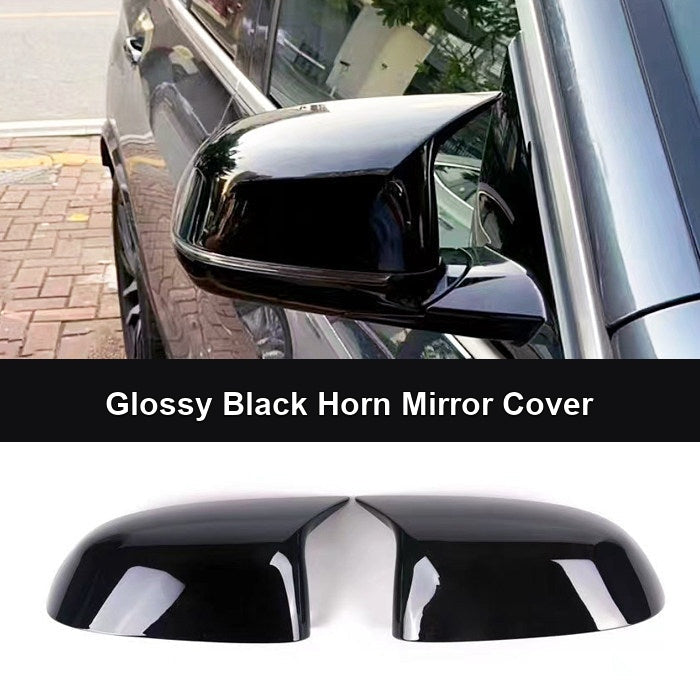 BMW glossy black horn mirror cover pair on white background