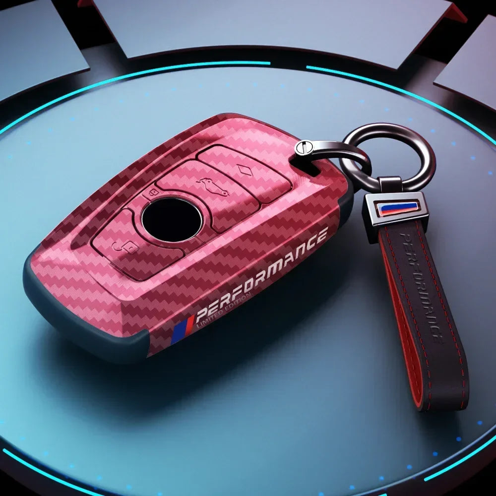 BMW red carbon fiber key case with keychain, front angle