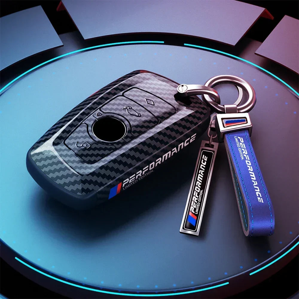 BMW dark carbon key case with blue M Performance keychain
