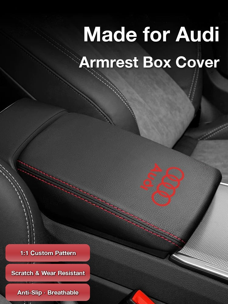 Audi armrest box cover in black leather with red stitching and red Audi logo