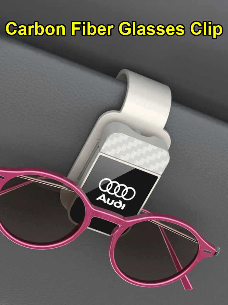 White Audi carbon fiber glasses clip on a car sun visor