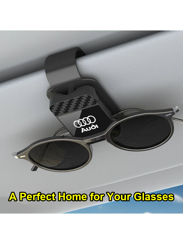 Audi carbon fiber sunglasses clip mounted on the sun visor