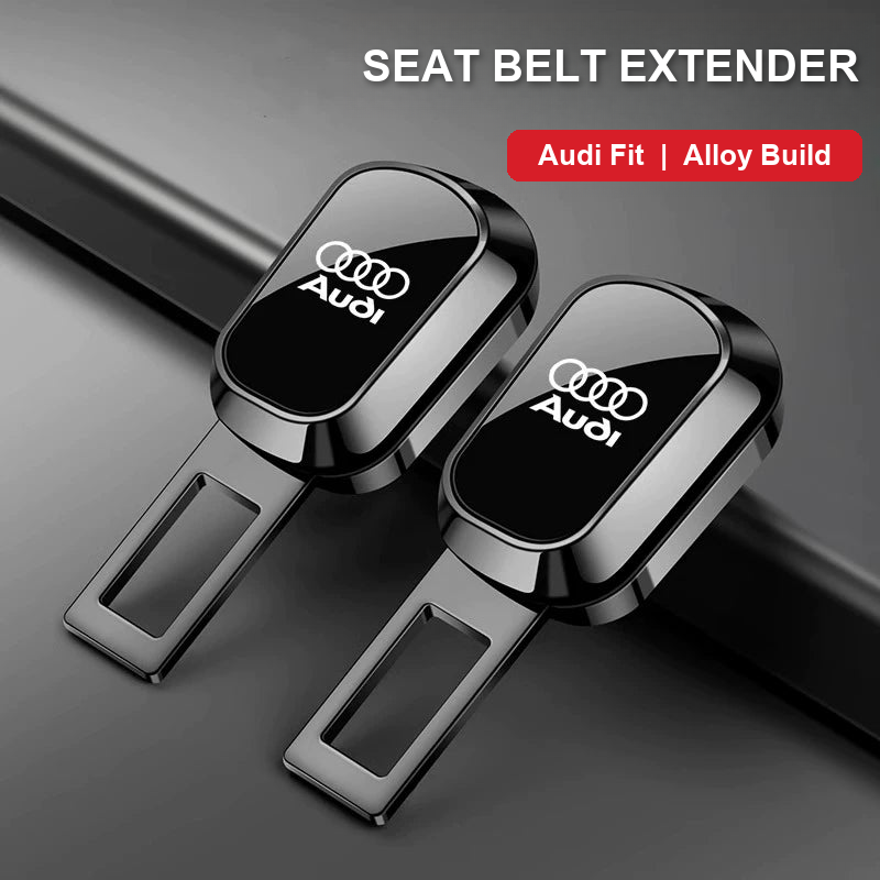 Audi Signature seat belt extender pair in gloss black alloy with Audi rings inlay