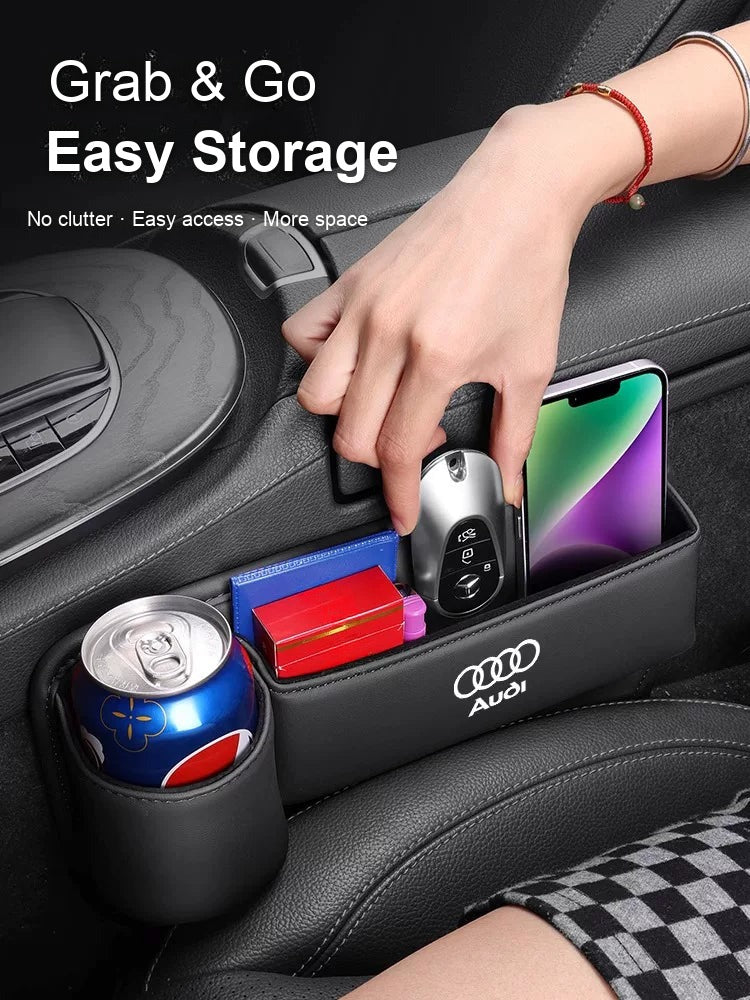Audi seat gap organizer holding keys, phone and a drink