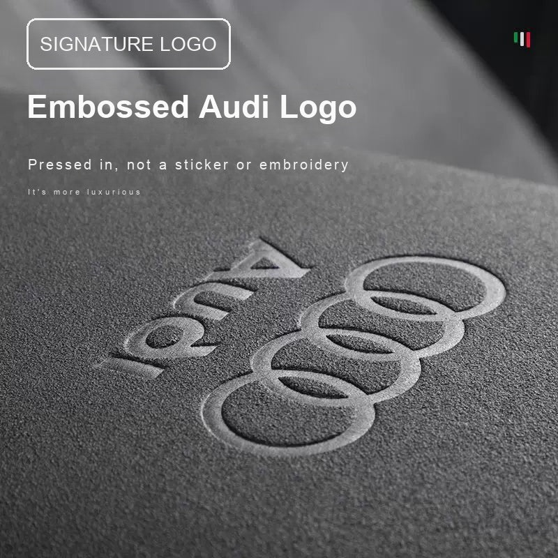 Embossed Audi logo pressed into the suede armrest cover