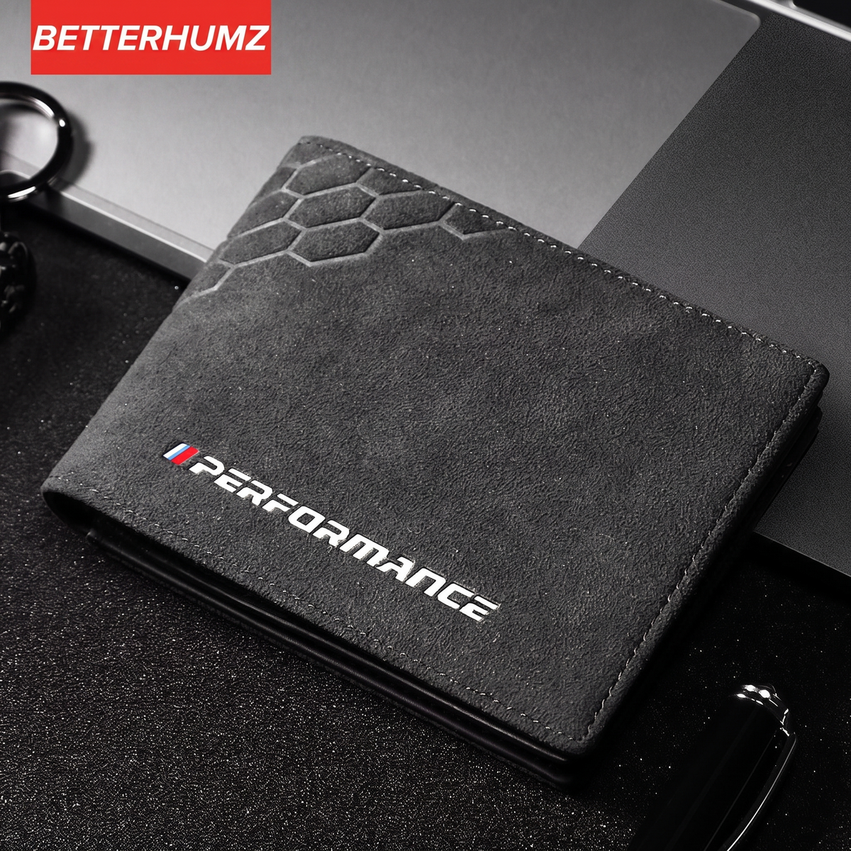 BMW Performance leather driver's license case on laptop