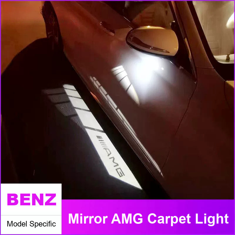 Model-specific AMG light carpet glowing from a Mercedes-Benz side mirror