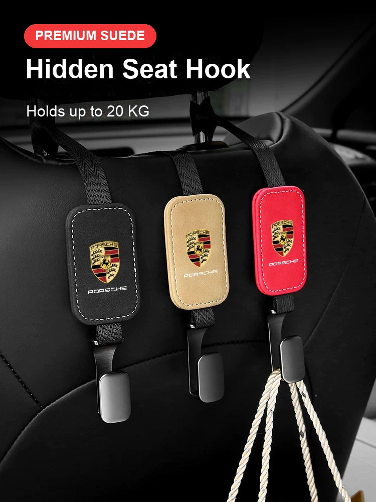 Porsche suede seat back hooks in black, beige and red on a headrest