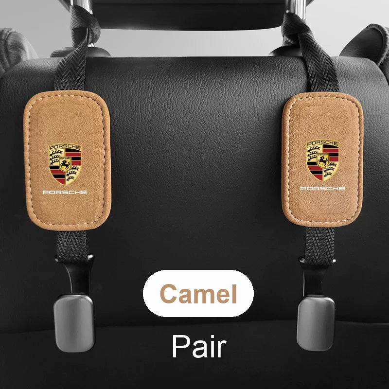 Porsche suede seat back hooks in camel, pair on a headrest